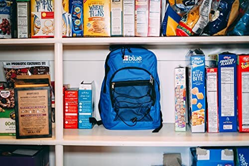 Blue backpack on pantry shelf surrounded by cereal boxes.