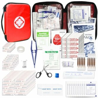 Comprehensive first aid kit with medical supplies and tools.