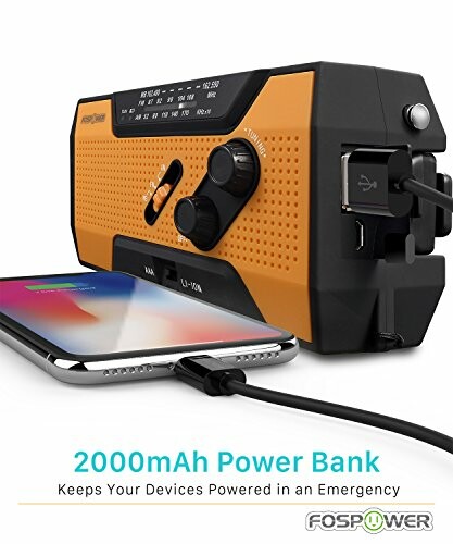 Emergency power bank radio charging a smartphone.