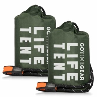 Two green emergency survival tents with carrying straps.