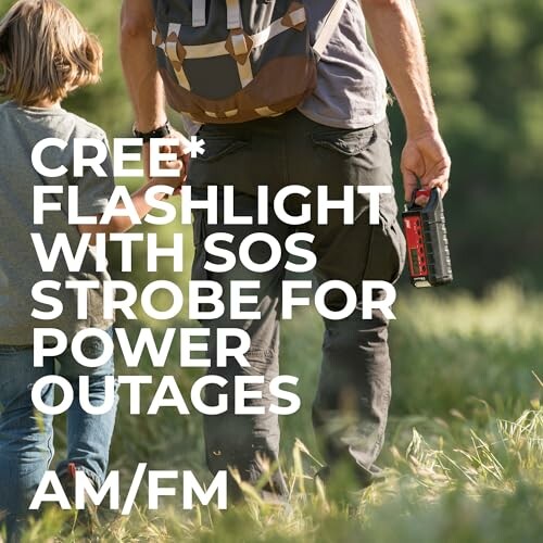 Man and child hiking with a flashlight, outdoors.