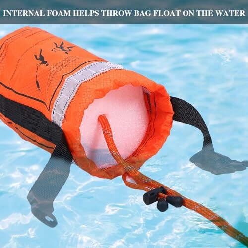Orange lifesaver bag floating on water with internal foam.