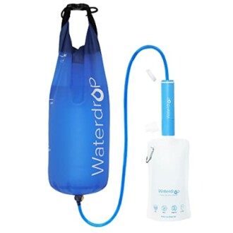 Portable water filtration system with blue water bag and filter pump.