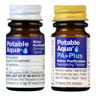 Two bottles of Potable Aqua water purification tablets.