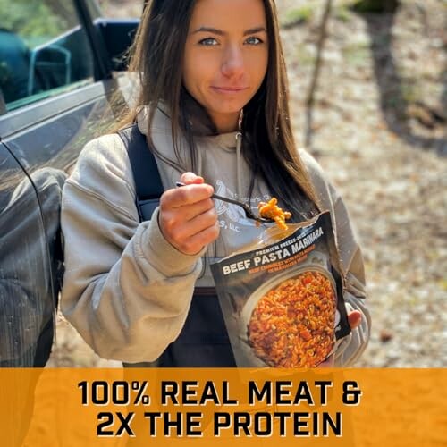 Woman enjoying beef pasta outdoors near a vehicle